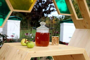 Apple and honey at wood table