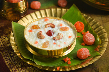 Diwali or Onam festival sweet food vermicelli Kheer, Semiya payasam Indian sweet Mithai with condensed milk in golden bowl for Dusshera, holi, Ramadan North India. dessert of Kerala Onam Sadhya, Vishu