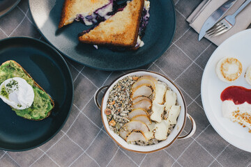 Picnic with homemade granola and fresh toasts outdoors.