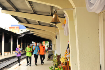 The yellow bell was hanging at The train station in Samutsakorn province, Thailand 