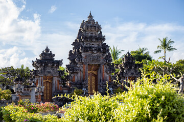 Traditional Balinese architecture. Door with beautiful stone carving. Landscape scenery. Tropical...