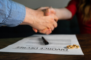 Former husband and wife shake hands.