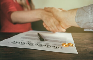Former husband and wife shake hands.