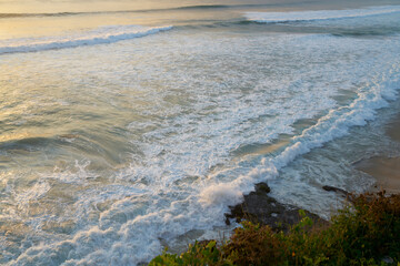 Foamy waves splashing near coast