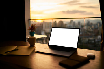 Laptop with empty screen on table