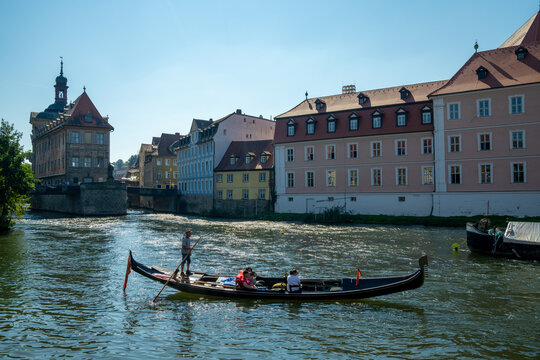 the Regnitz river in Bamberg with a gondola on a ruise
