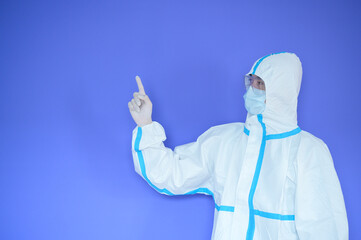An Asian man is wearing ppe suit on purple background