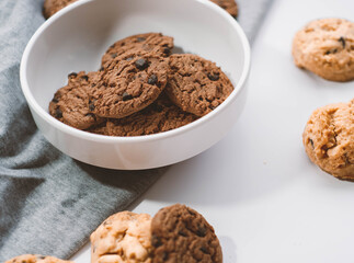 Delicious chocolate cookies placed in a white plate, snack, breakfast.