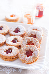 Traditional christmas linzer cookies on a white dish, selective focus