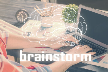 Start up drawings with businessman working on computer on background. Teamwork concept. Double...