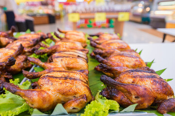 Grilled chicken on the table for sale in the supermarket.