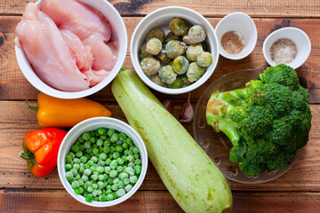 Cooking baked vegetables with chicken step by step, step 1 - preparing ingredients, top view, horizontal