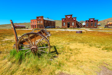 Rusty wreck of a vintage old cart if wood. Bodie state historic park, Californian Ghost Town of the...