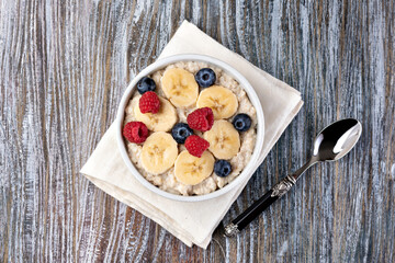 prepared oatmeal with fruits and berries