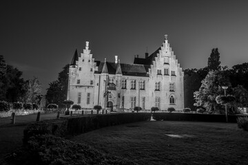 Fototapeta na wymiar Cortewalle Castle, in Beveren, Belgium, at night - black and white