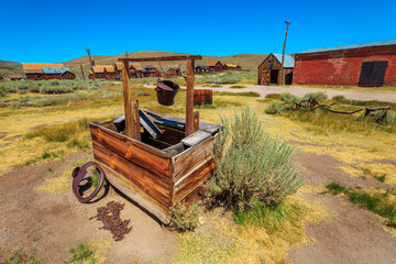 Fototapeta na wymiar water well of the ancient 1800s buildings in Bodie state historic park, California Ghost Town. United States of America, close to Yosemite national park.