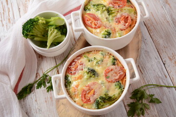 Broccoli, cheese and  egg casserole in baking cocottes