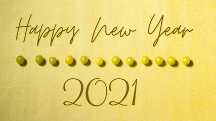 The traditional grapes of luck on golden background. Happy New Year 2021
