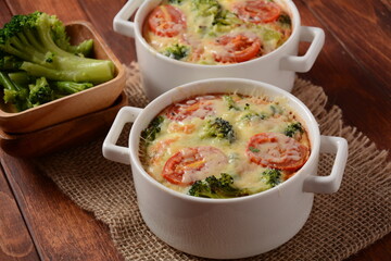 Broccoli, cheese and  egg casserole in baking cocottes