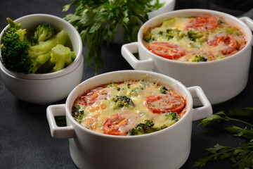 Broccoli, cheese and  egg casserole in baking cocottes