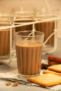 Indian Cutting Chai or Masala Tea with Spices Served in Glasses in a Roadside Shop