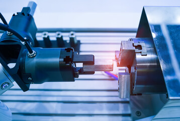 robotic arm catch for electronic assembly line. The robot for smart technology manufacturing...