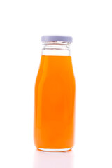 Fresh organic orange juice in glass bottles On a white background