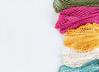 Assortiment of reusable cotton mesh bags or shoppers. Zero waste, plastic free concept