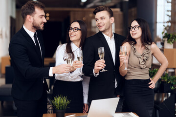 People in business clothes are listening a toast. 