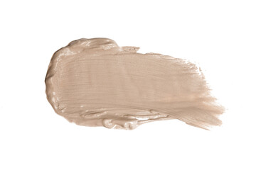 Creamy beige makeup or cosmetic product smeared on white	