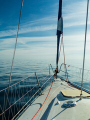 Fototapeta na wymiar Yachting on sail boat during sunny weather