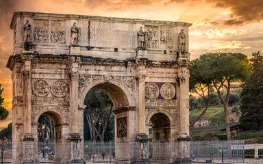 Rome/Italy -February 23, 2019:The triumphal Arch of Constantine next to the Colosseum in Rome. - obrazy, fototapety, plakaty