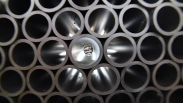 Black plastic tubes in the manufacturing warehouse
