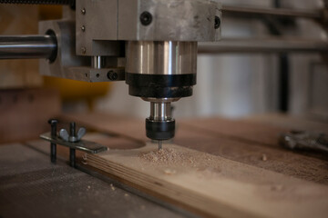 CNC drilling machine. Drill work on wood. 