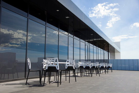 Tables and chairs on rooftop alfresco