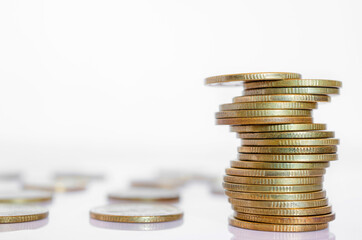 gold coin stack row growing pile on white background for money saving and investment business financial and banking concept.