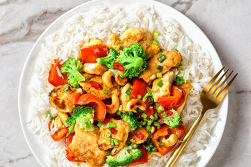 Asian cashew chicken on a white marble background