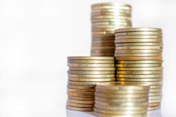 gold coin stack row growing pile on white background for money saving and investment business financial and banking concept.