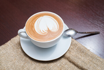Delicious, aromatic and freshly made cappuccino with a pattern