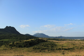 Summer natural landscape with mountains in the background.