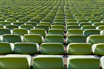 Fototapeta premium endless rows of enpty chairs in a stadium