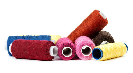 Coils of colored thread on a white background