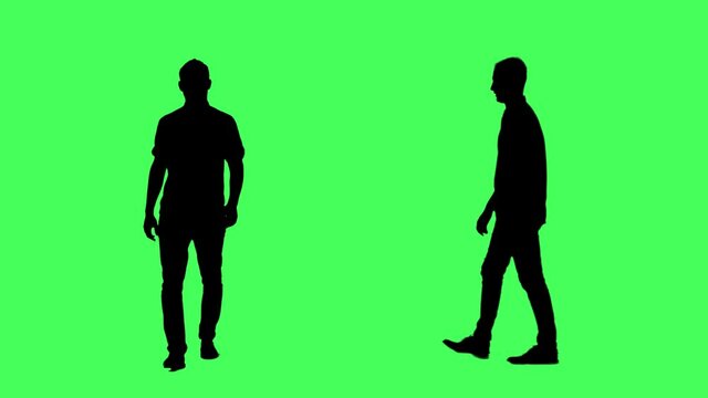 Silhouettes of confident business man walking. Side and front view. Full body on green screen chroma key background.