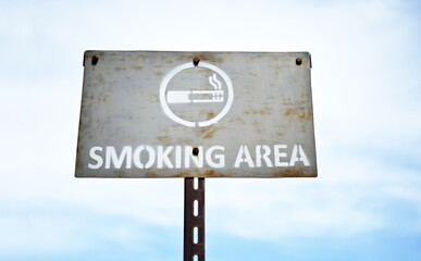  smoking area signboard ;allow smoking  in the sky.