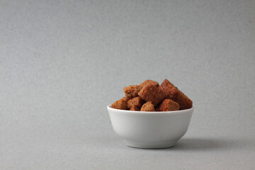 a bowl of dentels isolated on gray background