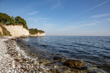 Fototapeta na wymiar Stevns Klint is a steep coast in the southeast of the Danish Baltic Sea island of Zealand. The cliff is about 15 kilometers long and rises up to 41 meters above sea level. In 2014 UNESCO awarded the c