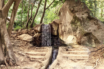 Small waterfall in the Park. Summer