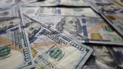 Hundred dollar Ben franklin bills in pile for business and financial concept.  American US dollar...