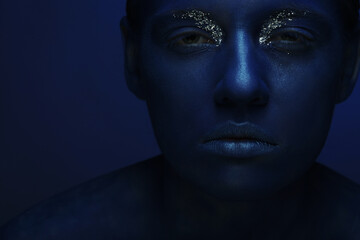 woman with dark blue face