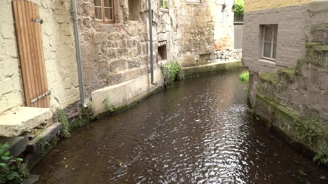 Old street with canel river water in ally with Europe stone house building vintage italy style